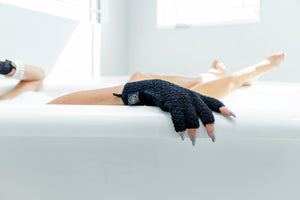 Black Fingerless Exfoliating Glove - Woman in the tub